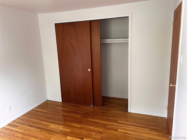 25731 Salem Ct Unit 63, Roseville, MI 48066 - unfurnished bedroom featuring a closet and wood finished floors