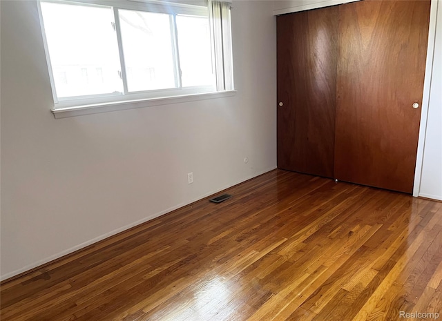 25731 Salem Ct Unit 63, Roseville, MI 48066 - unfurnished bedroom featuring wood finished floors and a closet