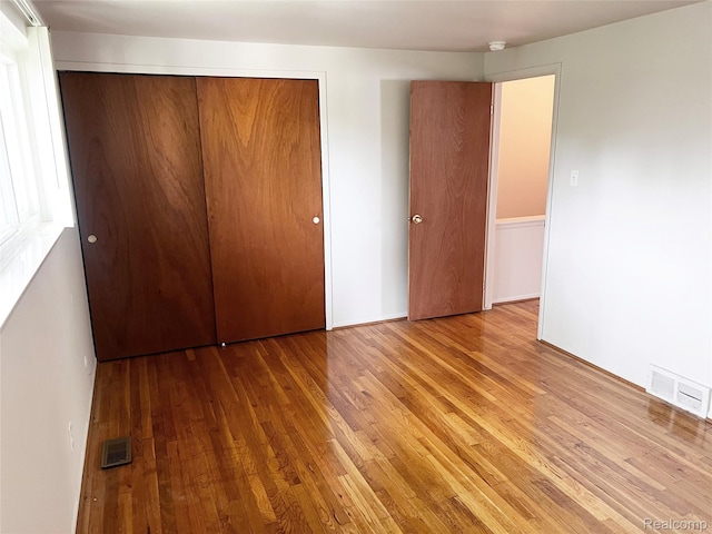 25731 Salem Ct Unit 63, Roseville, MI 48066 - unfurnished bedroom with wood finished floors and a closet