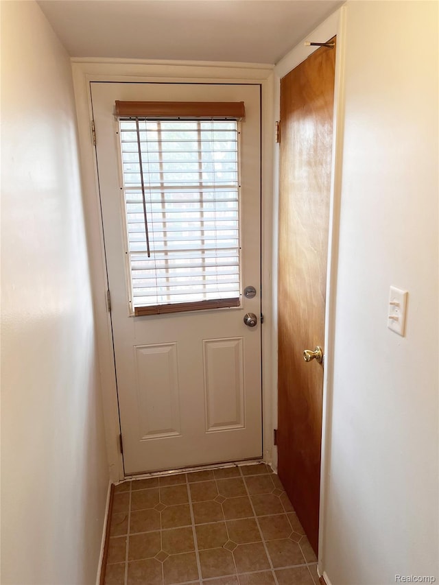 25731 Salem Ct Unit 63, Roseville, MI 48066 - doorway featuring tile patterned flooring and baseboards