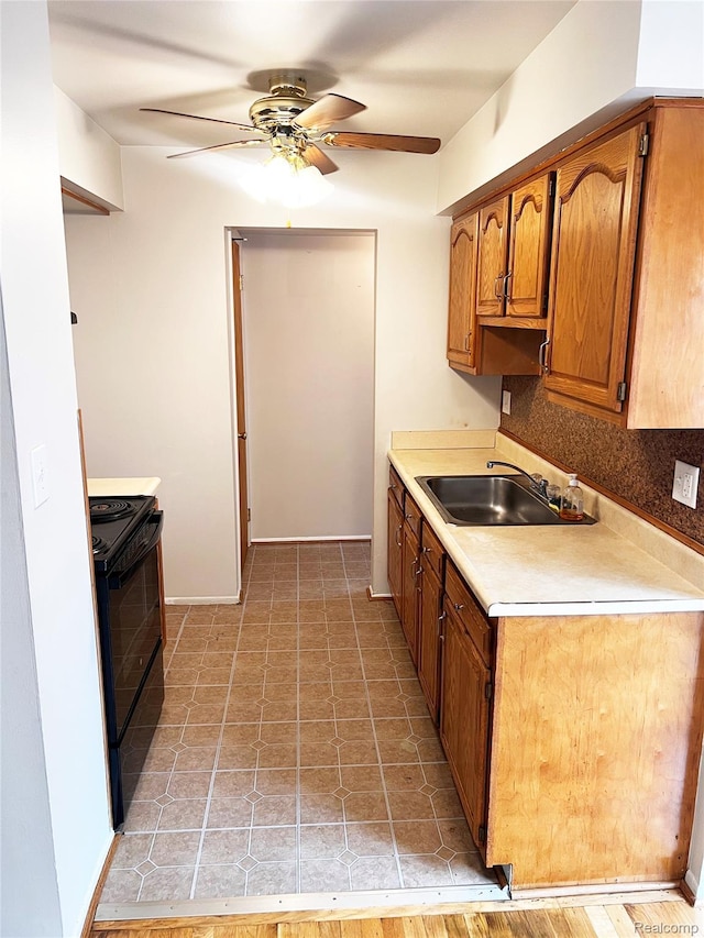 25731 Salem Ct Unit 63, Roseville, MI 48066 - kitchen with black electric range oven, a ceiling fan, light countertops, brown cabinetry, and backsplash