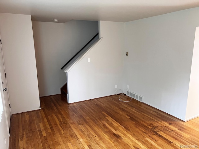 25731 Salem Ct Unit 63, Roseville, MI 48066 - unfurnished room featuring hardwood / wood-style flooring and stairs