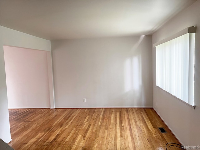 25731 Salem Ct Unit 63, Roseville, MI 48066 - unfurnished room with light wood finished floors and baseboards