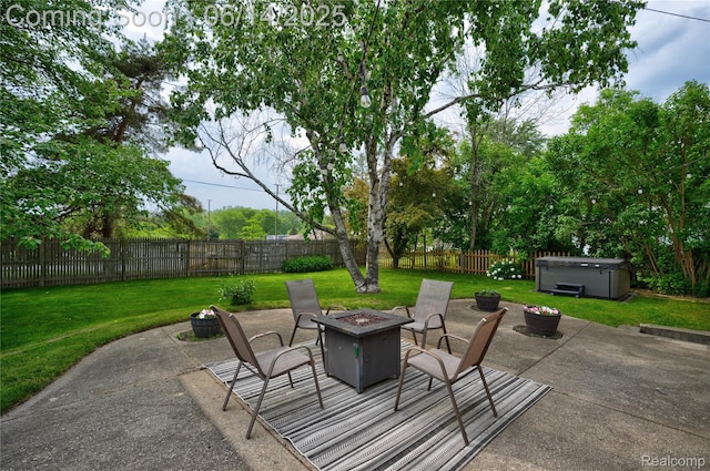 5388 N Georgetown Rd, Grand Blanc, MI 48439 - fenced backyard with a hot tub, an outdoor fire pit, and a patio area
