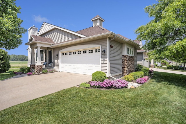 1300 St Andrews Dr, Holland, MI 49423 - view of front facade featuring a garage, a front lawn, concrete driveway, and roof with shingles