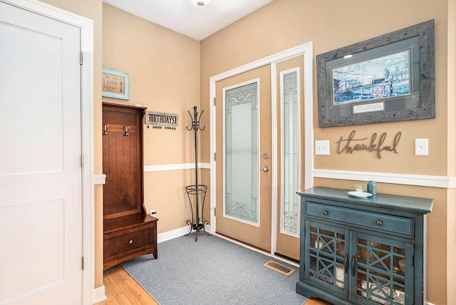 1300 St Andrews Dr, Holland, MI 49423 - entryway with baseboards and wood finished floors