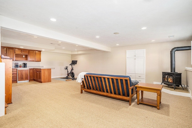 1300 St Andrews Dr, Holland, MI 49423 - bedroom featuring light carpet, recessed lighting, baseboards, a wood stove, and bar area