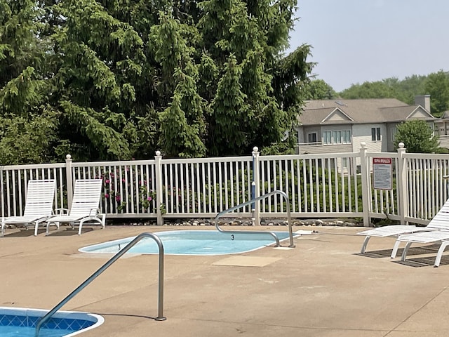 1300 St Andrews Dr, Holland, MI 49423 - community pool featuring a patio area