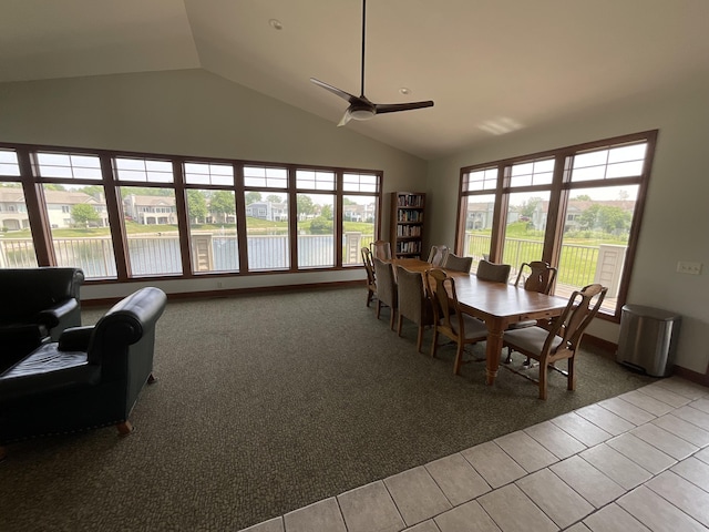 1300 St Andrews Dr, Holland, MI 49423 - carpeted dining space featuring a ceiling fan, a water view, tile patterned flooring, and high vaulted ceiling