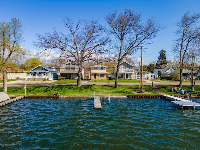 114 W Grove Ave, Michigan Center, MI 49254 - dock featuring a water view, a yard, and a residential view