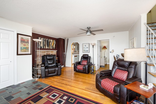 114 W Grove Ave, Michigan Center, MI 49254 - living area featuring stairway, crown molding, wood finished floors, ceiling fan, and baseboards