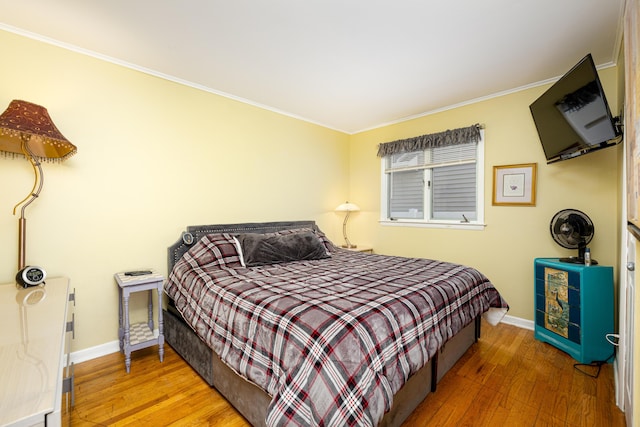 114 W Grove Ave, Michigan Center, MI 49254 - bedroom with hardwood / wood-style flooring, baseboards, and ornamental molding