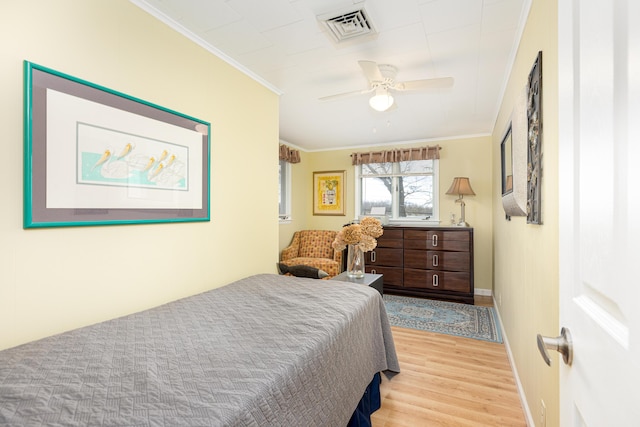 114 W Grove Ave, Michigan Center, MI 49254 - bedroom with crown molding, light wood-style flooring, baseboards, and a ceiling fan