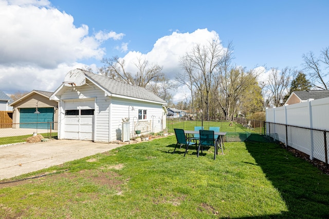 114 W Grove Ave, Michigan Center, MI 49254 - view of yard with an outdoor structure and a garage
