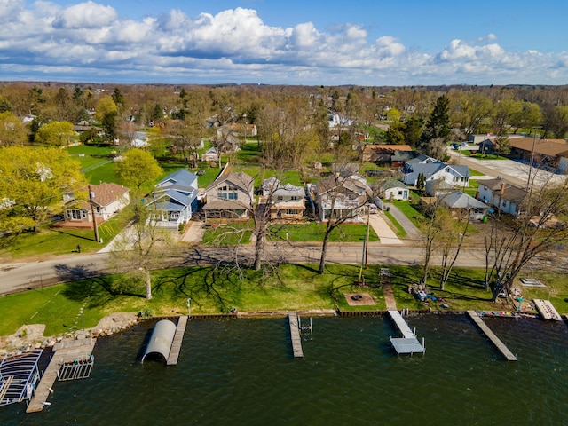 114 W Grove Ave, Michigan Center, MI 49254 - aerial perspective of suburban area with a nearby body of water