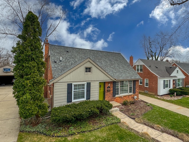 4422 Groveland Ave, Royal Oak, MI 48073 - view of front of house with a chimney, roof with shingles, and brick siding