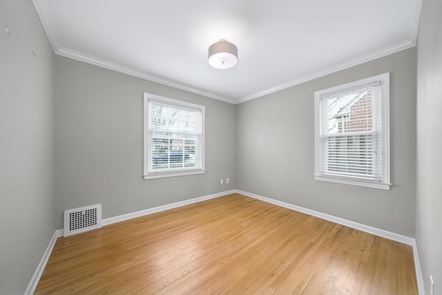 4422 Groveland Ave, Royal Oak, MI 48073 - empty room with plenty of natural light, light wood-style floors, baseboards, and ornamental molding