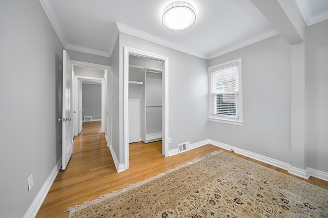 4422 Groveland Ave, Royal Oak, MI 48073 - unfurnished bedroom featuring light wood-style floors, crown molding, and baseboards