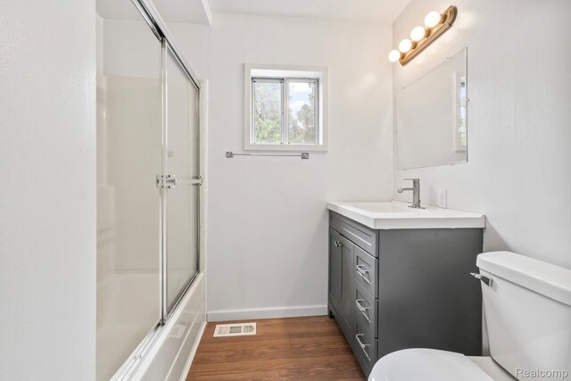 1496 E Parkwood Ave, Burton, MI 48529 - bathroom featuring vanity and wood finished floors