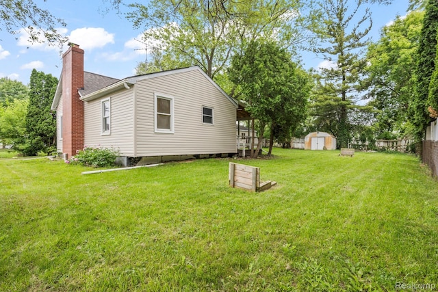 1496 E Parkwood Ave, Burton, MI 48529 - view of yard featuring a storage unit