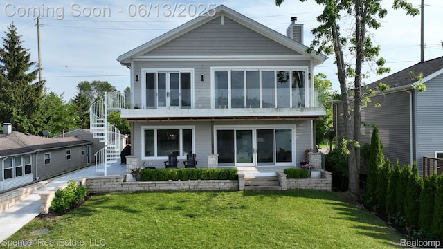 571 Dunleavy Dr, Highland, MI 48356 - rear view of house with a chimney, stairs, a yard, and a patio