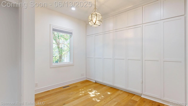 571 Dunleavy Dr, Highland, MI 48356 - unfurnished dining area featuring light wood-type flooring and baseboards