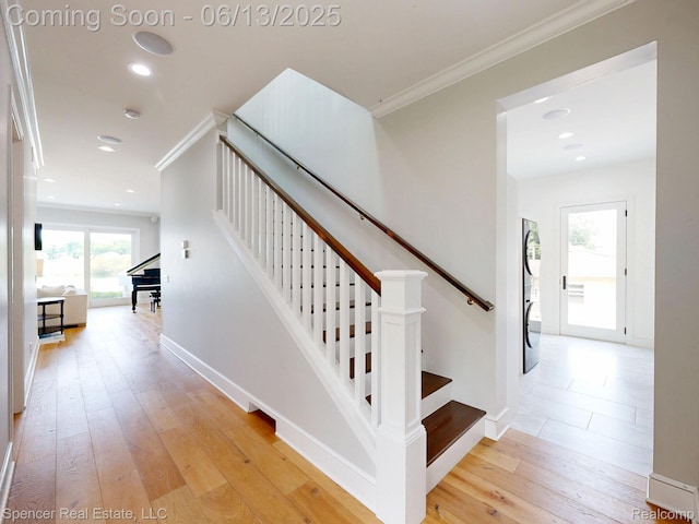 571 Dunleavy Dr, Highland, MI 48356 - stairway featuring ornamental molding, wood-type flooring, baseboards, and recessed lighting