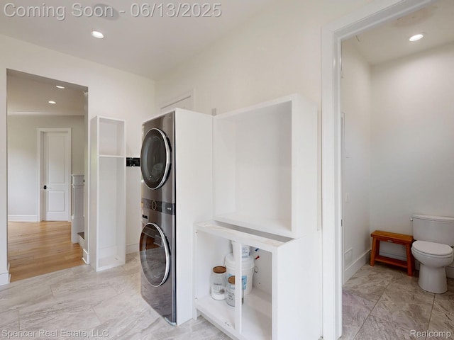 571 Dunleavy Dr, Highland, MI 48356 - washroom featuring stacked washer / dryer, baseboards, recessed lighting, and light marble finish flooring
