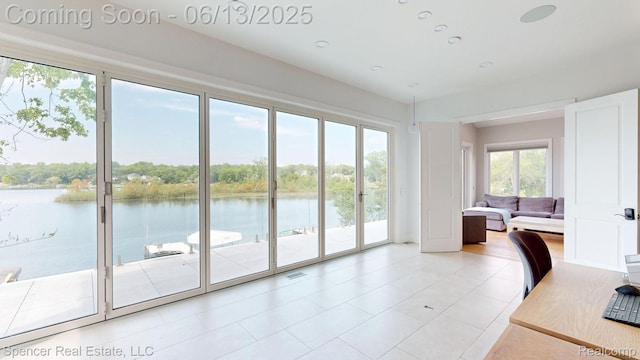 571 Dunleavy Dr, Highland, MI 48356 - office area featuring a water view and light tile patterned floors