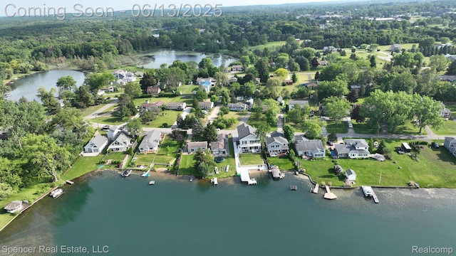 571 Dunleavy Dr, Highland, MI 48356 - aerial view of property's location with a large body of water, a forest, and nearby suburban area