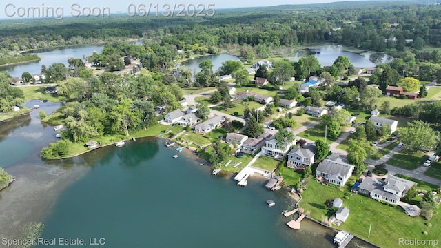 571 Dunleavy Dr, Highland, MI 48356 - aerial view of property's location with a forest and a nearby body of water