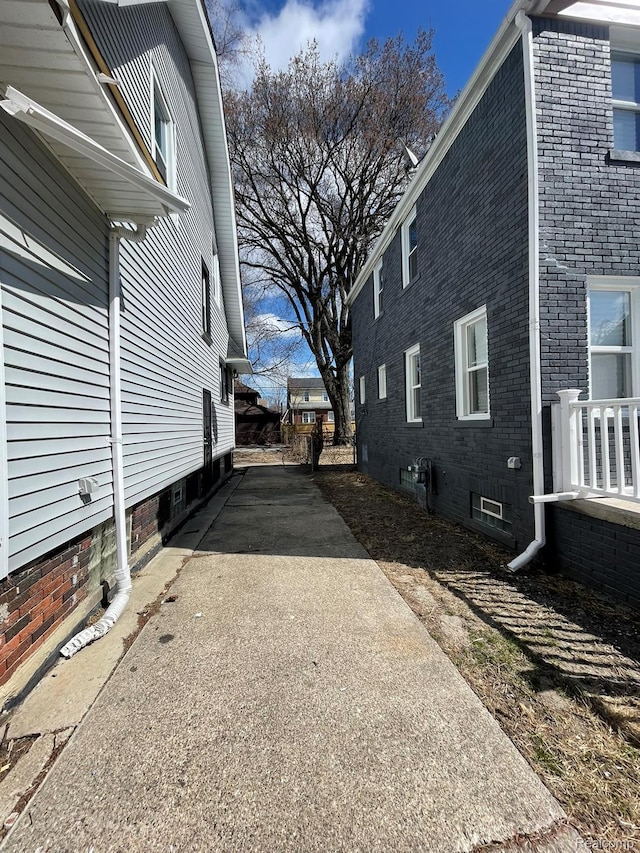 4368 Buckingham Ave, Detroit, MI 48224 - view of property exterior featuring brick siding and driveway