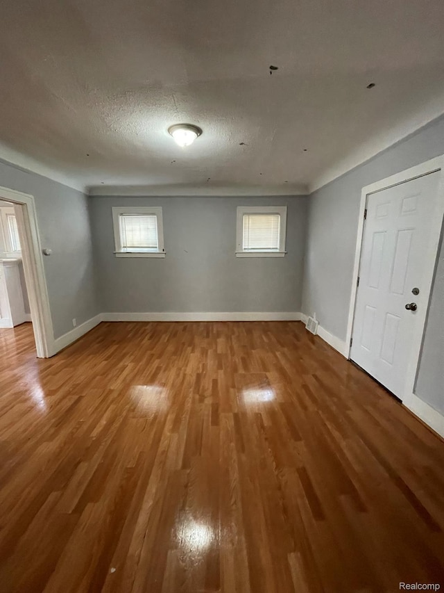 4368 Buckingham Ave, Detroit, MI 48224 - unfurnished room with wood finished floors, healthy amount of natural light, and baseboards