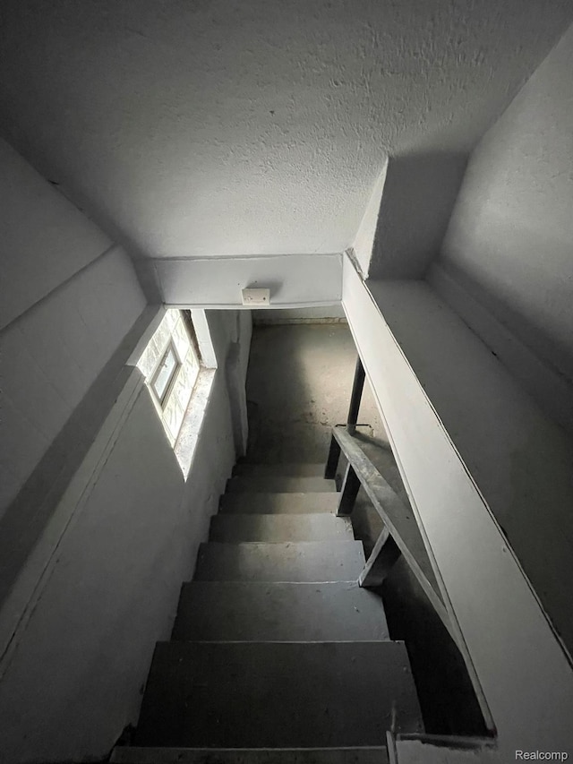 4368 Buckingham Ave, Detroit, MI 48224 - stairway featuring a textured ceiling