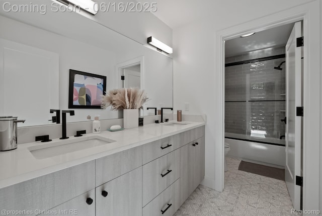 1044 Hazel, Birmingham, MI 48009 - bathroom featuring double vanity, combined bath / shower with glass door, and tile patterned floors
