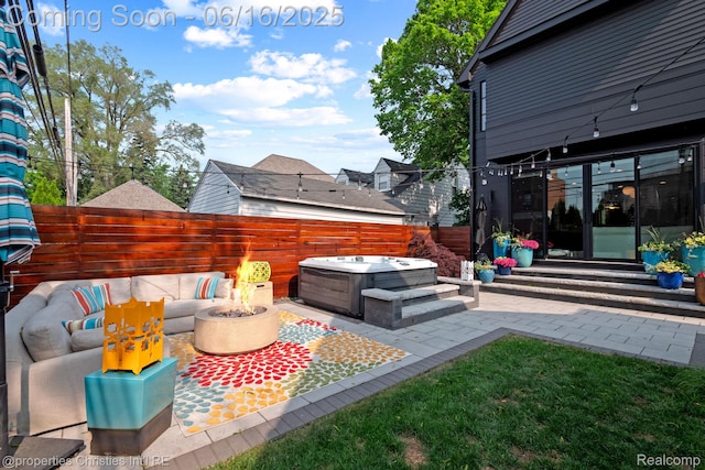 1044 Hazel, Birmingham, MI 48009 - fenced backyard featuring a hot tub, a fire pit, and a patio