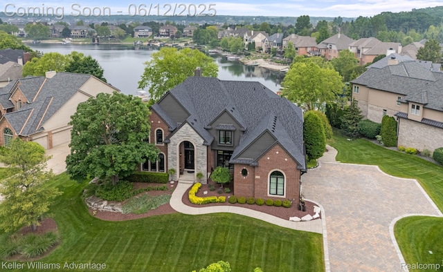 10993 Stoney Point Dr, South Lyon, MI 48178 - aerial view of residential area with a nearby body of water