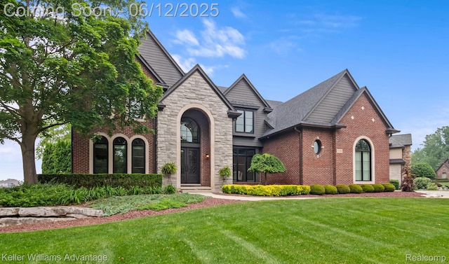 10993 Stoney Point Dr, South Lyon, MI 48178 - view of front of property with a front lawn, stone siding, and brick siding