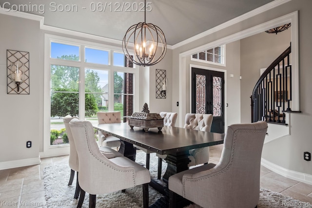 10993 Stoney Point Dr, South Lyon, MI 48178 - dining area featuring a chandelier, crown molding, baseboards, and stone tile floors