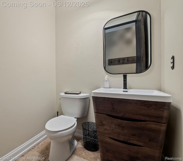 10993 Stoney Point Dr, South Lyon, MI 48178 - half bathroom with vanity, baseboards, toilet, and tile patterned flooring