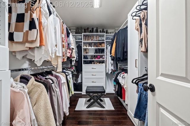 10993 Stoney Point Dr, South Lyon, MI 48178 - walk in closet with dark wood-type flooring