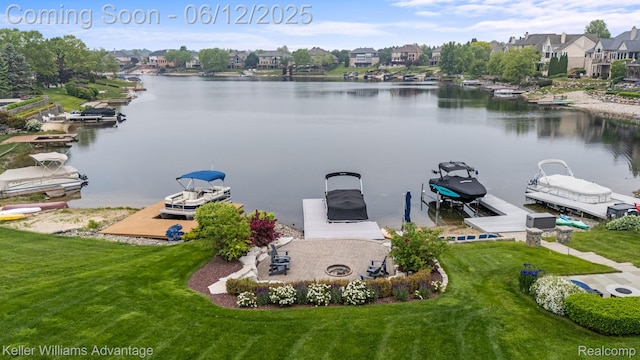 10993 Stoney Point Dr, South Lyon, MI 48178 - aerial perspective of suburban area with a nearby body of water