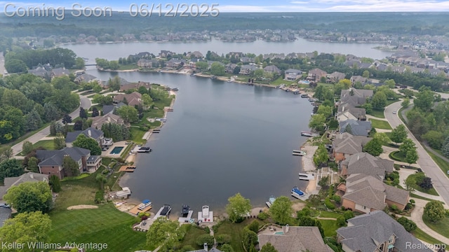 10993 Stoney Point Dr, South Lyon, MI 48178 - aerial view of property and surrounding area with a nearby body of water and nearby suburban area