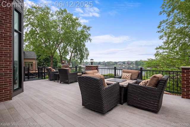 10993 Stoney Point Dr, South Lyon, MI 48178 - deck featuring a water view and an outdoor hangout area