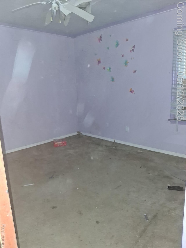 709 E Margaret St, Highland Park, MI 48203 - spare room with a ceiling fan, unfinished concrete floors, and baseboards