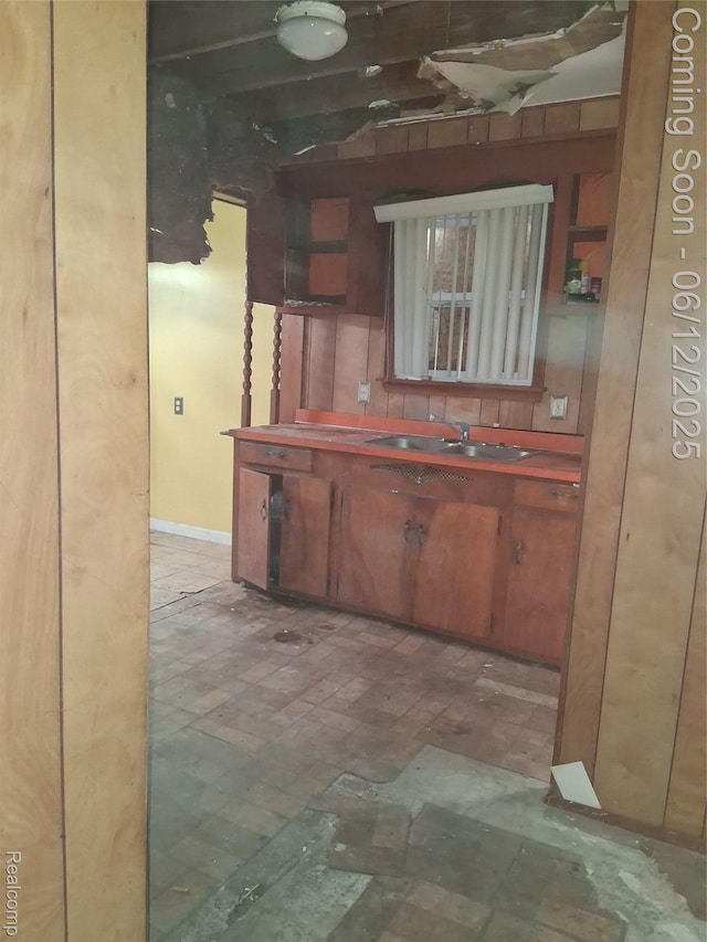 709 E Margaret St, Highland Park, MI 48203 - kitchen featuring a sink and brown cabinetry
