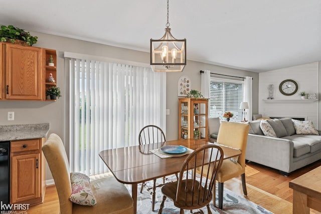 1273 Crystal Pointe Cir, Fenton, MI 48430 - dining space featuring light wood-type flooring and a chandelier