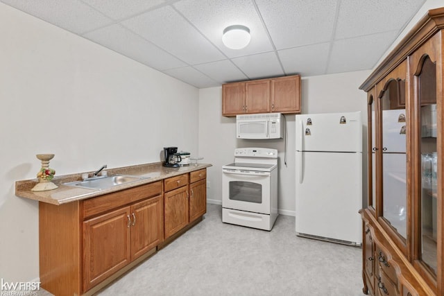 1273 Crystal Pointe Cir, Fenton, MI 48430 - kitchen featuring white appliances, a drop ceiling, brown cabinetry, and light countertops