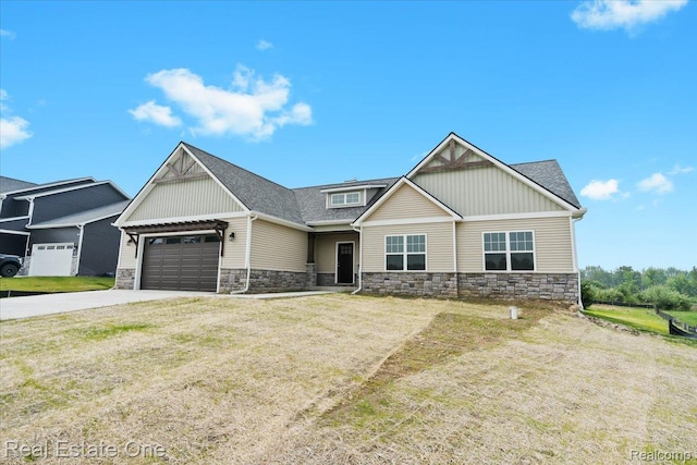 2763 Clivedon Rd, Howell, MI 48843 - craftsman house with stone siding, a garage, concrete driveway, and a front yard
