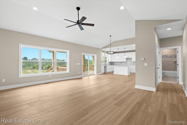 2763 Clivedon Rd, Howell, MI 48843 - unfurnished living room with a ceiling fan, baseboards, a chandelier, light wood-style floors, and recessed lighting